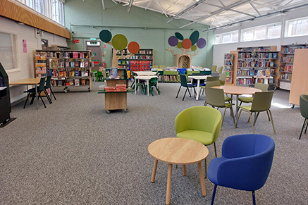 Rathcoole Library Interior - open area with chairs and tables
