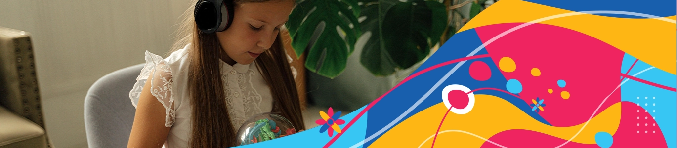 A photo of a young girl wearing headphones