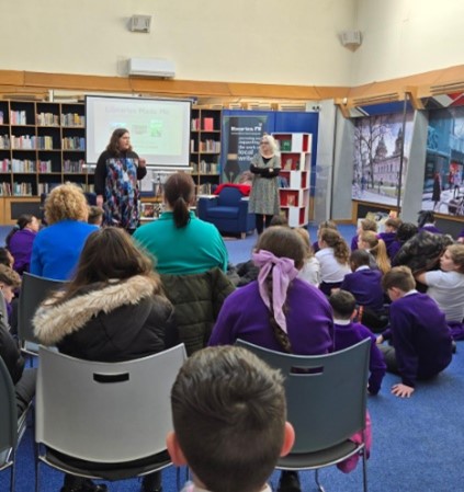 Author Sheena Wilkinson speaking to an audience in the library