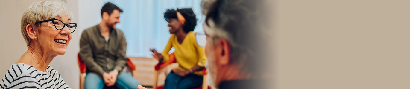 A group of people chatting in a library