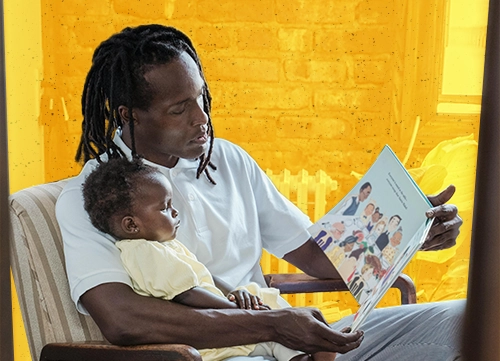 A father reading a book with his child