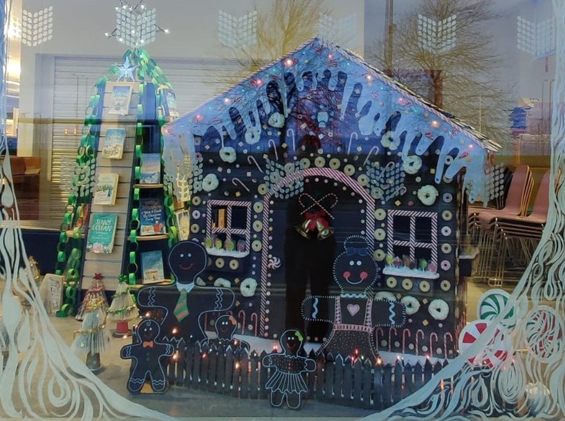 photo of a Gingerbread house in a library window display