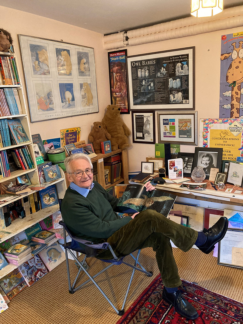 Author Martin Waddell showing Jillian his famous story ‘Owl Babies’ whilst surrounded by books he has written and his awards
